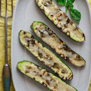 Grilled Little Milk Company Cheddar Zucchini Boats with Balsamic Leeks